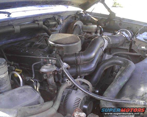 1996 Ford Bronco engine bay with air intake and alternator visible