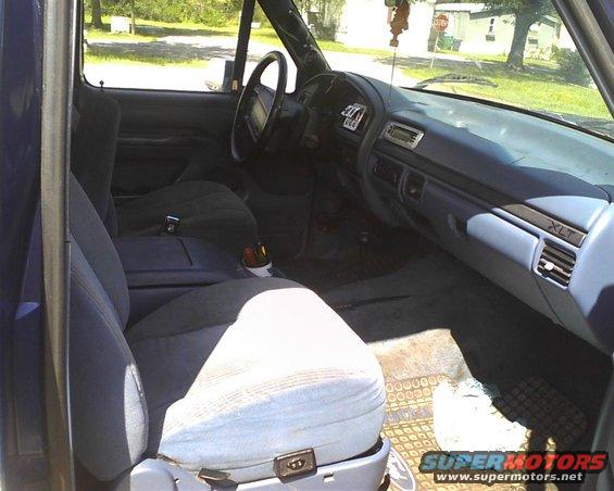 1996 Ford Bronco interior showing front seats, dashboard, and steering wheel