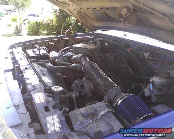 1996 Ford Bronco engine bay with blue air filter