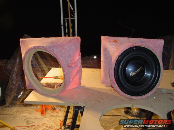 Custom subwoofer box under construction, one speaker visible with 'PREMIER' logo