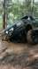 1990 Ford Bronco - This 1990 Ford Bronco is stuck deep in the mud on a wooded trail.