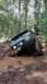 1990 Ford Bronco - This 1990 Ford Bronco is stuck deep in the mud on a wooded trail.