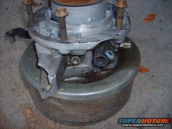 parking-brake-002.jpg You can see where the guide for the cable is broken off on one side. 
Overall body length is ~9 1/2".
~2 1/2" of that goes into the tail of the tranny