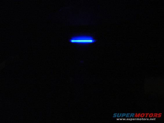blue light strip on black background, supermotors.net logo at bottom right