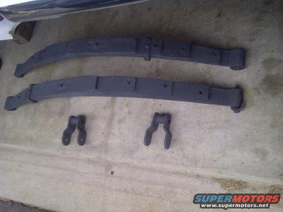 Leaf springs and shackles primed