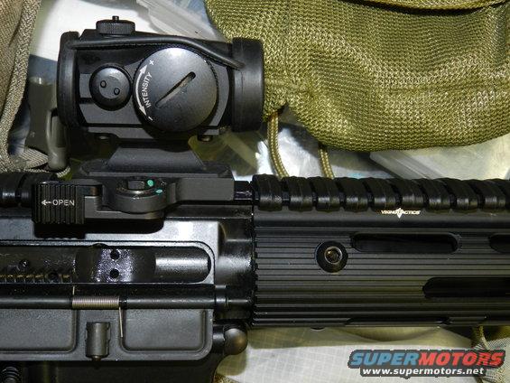 Rifle with red dot sight and "OPEN" lever