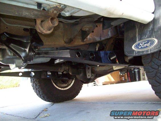 Undercarriage view of a 1993 Ford F-150 with a custom suspension component