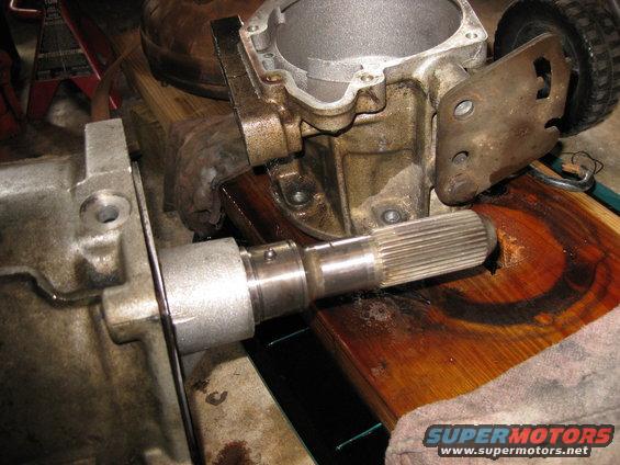 img_0532.jpg The governer is held onto the tailshaft by a snap ring. when removed there is a small metal ball left behind. It may pop out when the governer is removed.