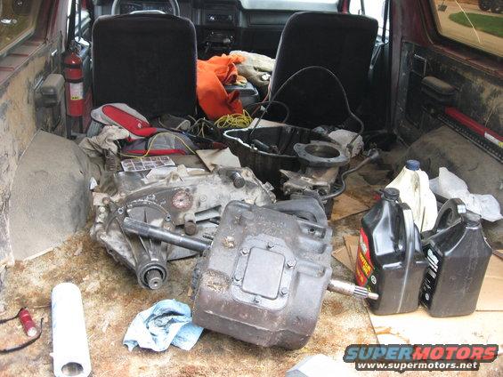 Interior of 1981 Ford Bronco with transmission parts and fluids