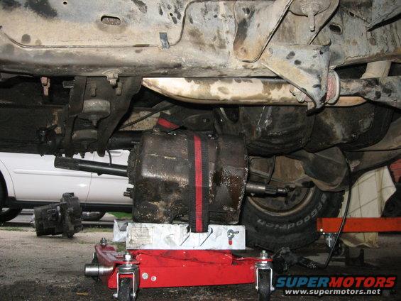 Getting the transmission into place to go up.  I didn't want to mess with the crossmember (they're REALLY well bolted on on Ford trucks), so I figured I'd slide the output shaft over the top of it, back it up, and then slide the input shaft into the engine.

That was a big mistake. I fought with it for hours until it finally got dark.  I *could* have easily done this if I hadn't put the engine in first (which is in at this point), but I didn't.  The next morning, I took the time to unbolt the cross member (which, no, is not easy to remove, and takes a 15mm and 18mm for what it's worth), but it was a lot easier to remove than wrestling with that transmission for hours.

After the crossmember was moved, the transmission went right in.