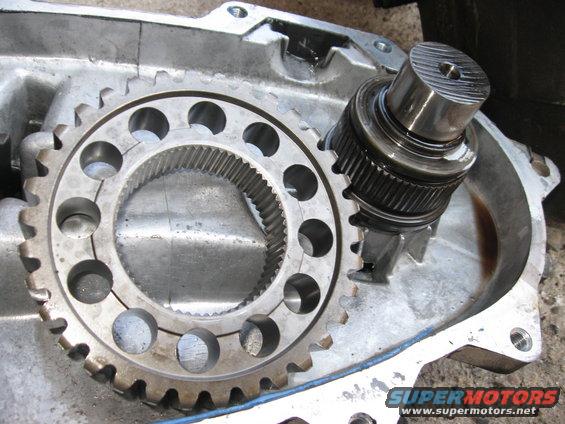 The chain has NO lateral movement in it, so once the clip is off, you have to slide both gears on the ends of the chain off at the same time. They come out in one piece.  After you do, the chain will have slack, and you can just pull the gears out.