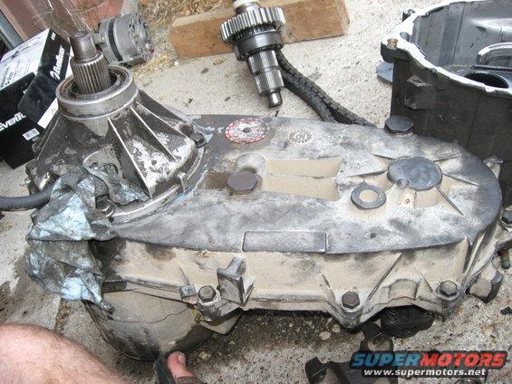 There is no gasket between the two sides of the casing, just a layer of silicone.  I scraped off the old stuff, put some fresh on, and bolted them back together.