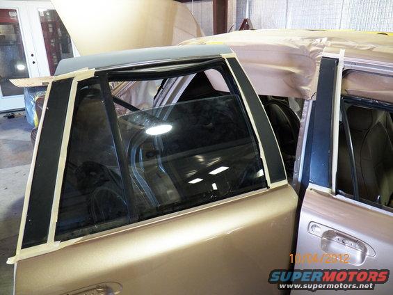 Taping the window pillars to have them scuffed and repainted black.