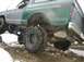 1979 Ford Bronco - Rear tire a few inches off the ground. Not to bad of flex for a fat tank.