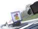 2003 Ford Crown Victoria - A Gusto Foods truck is seen on the highway, advertising 'Eat More Pork. Be a Better Lover.'