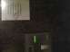 2003 Ford Crown Victoria - A note is attached to a wall near a doorbell panel.