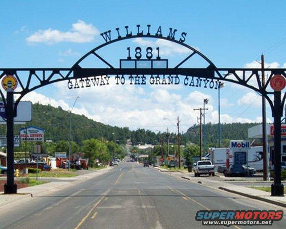 Archway over a street in Williams, Arizona, with 'Williams 1881 Gateway to the Grand Canyon' text