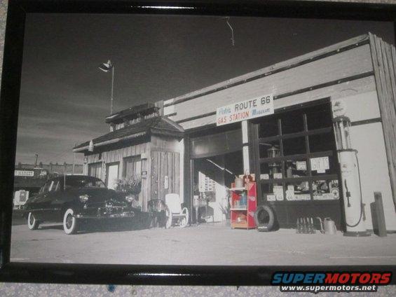 Old car parked outside a Route 66 gas station museum