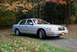 2008 Mercury Grand Marquis - A silver 2008 Mercury Grand Marquis sedan is seen from a three-quarter front view in an outdoor setting with fall colors.