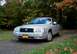 2008 Mercury Grand Marquis - A silver 2008 Mercury Grand Marquis is parked on a gravel road with autumn foliage in the background.