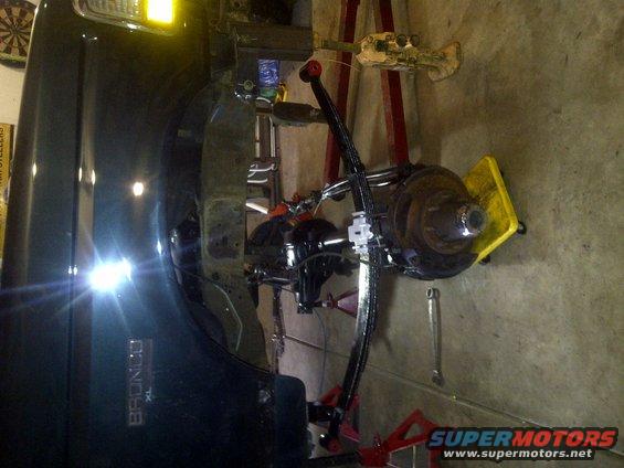 Ford Bronco XL rear axle assembly being worked on, with suspension components visible
