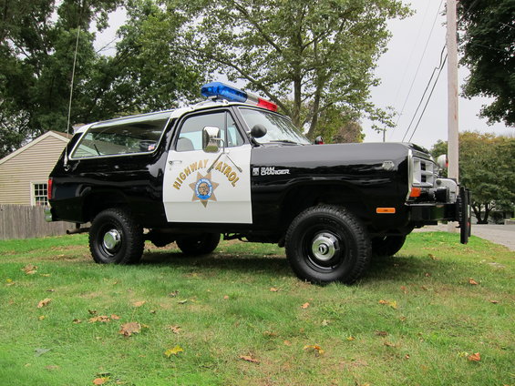 Black and white 1987 Dodge Ramcharger police SUV with "Highway Patrol" text and light bar