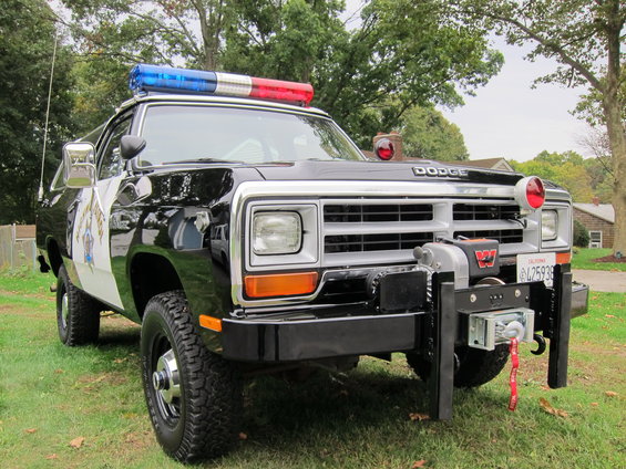 Dodge Ram police truck with light bar and winch. California plate L25938