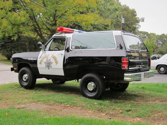 Black and white Dodge Ramcharger with "Highway Patrol" on the door and light bar on top