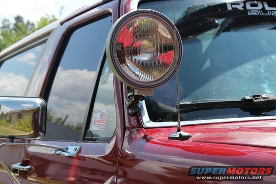A-pillar light on red SUV, side view