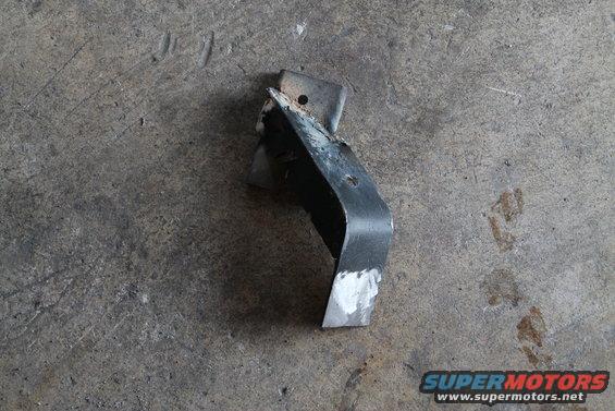 Metal bracket with two mounting holes and a bent section
