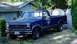 1986 Ford F-150 - This blue 1986 Ford F-150 pickup truck is parked in a residential driveway next to a fence and house.