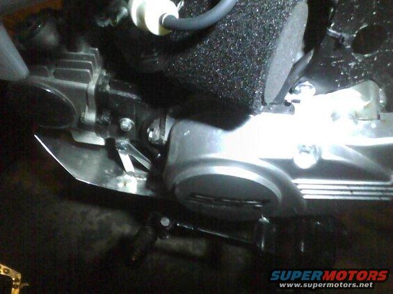 Engine part with metal shielding and black foam filter