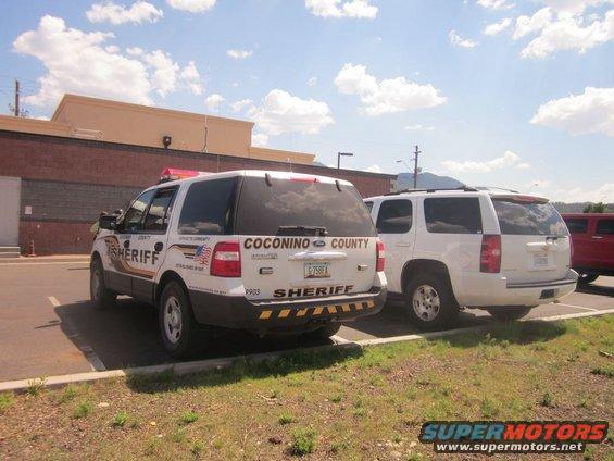 Two sheriff SUVs parked, one with 'Coconino County Sheriff' markings