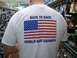 1989 Ford Bronco - A person stands in an aisle of a store, wearing a t-shirt with patriotic imagery and text.
