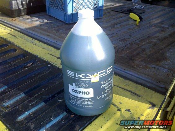 Bottle of Skyco Ospho rust treatment in a truck bed