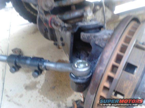 9.jpg Put the Tie Rod End in and tighten the nut and put the cotter pin in.