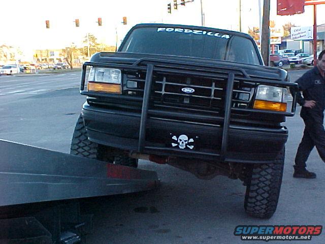 Black 1995 Ford Bronco front view with bull bar and "FORDIZILLA" windshield banner