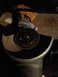 1996 Ford F-150 - An angle grinder with a cutting disc is shown, with a person's hand and boot in the background.