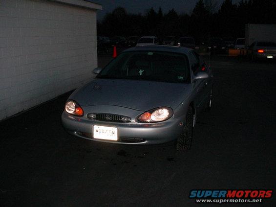 Silver 1999 Mercury Sable sedan, front view, at night