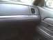 2003 Ford Crown Victoria - The interior of a car shows the dashboard with a carbon fiber-style trim piece.
