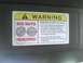 2003 Ford Crown Victoria - A humorous warning sticker on a car's sun visor advises "BIG NUTS REQUIRED" and warns of serious injury due to extreme horsepower.