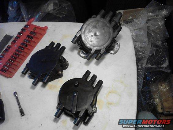 photo10171344.jpg Top - unknown disty , has existing coil plug? single harness plug 

Bottom - PRD disty cap w/ external coil, unknown application, 

Left - current disty cap, mounts to unknown disty w/ two harness plugs, 

