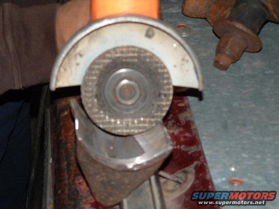 grinder02.jpg i taped the trigger so i could keep from using both hands on the tool. i draped the cord over my shoulder and put the handle on the top or back of the grinder to make i easier. its alot of grinding