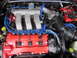 1993 Mazda MX-3 - Engine bay detail with red valve cover and blue spark plug wires.