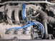 1993 Mazda MX-3 - Close-up view of the engine bay in a 1993 Mazda MX-3, highlighting the V6 DOHC 24-valve engine and its components.