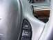 1999 Mercury Grand Marquis - Interior view of a steering wheel showing wear and tear, with cruise control buttons visible.