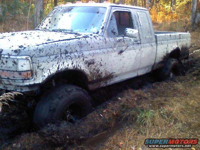 1993 Ford F-150 stuck in mud, 3q-front view
