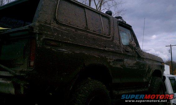 Mud-covered 1978 Ford Bronco parked outside