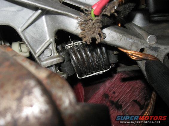 img_4333.jpg Back in place.  One end goes into a slot on the pedal bracket and the other end goes into the fork on the end of the clutch rod.  It's easiest to put it in place with the clutch fully pressed to the floor (have it disconnected from the linkage/master cylinder).