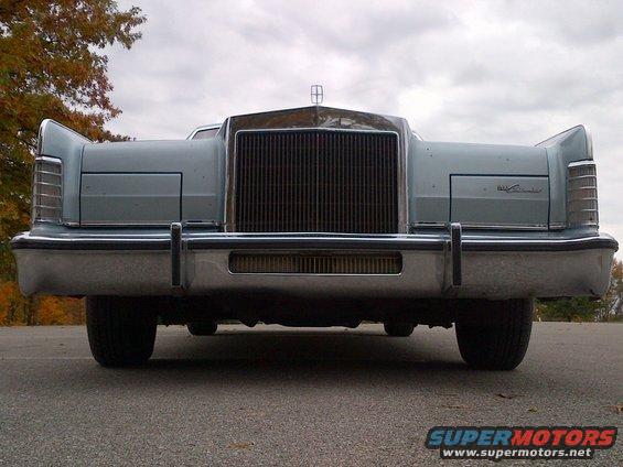1970s Lincoln Continental front end with chrome grille and bumper, light blue body